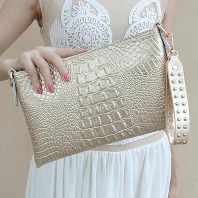 https://nuroco.com/cdn/shop/products/clutches-gold-black-genuine-cow-leather-clutch-bag-crocodile-texture-rivet-purse-also-in-metallic-gold-white-7089450909777.jpg?v=1572111355